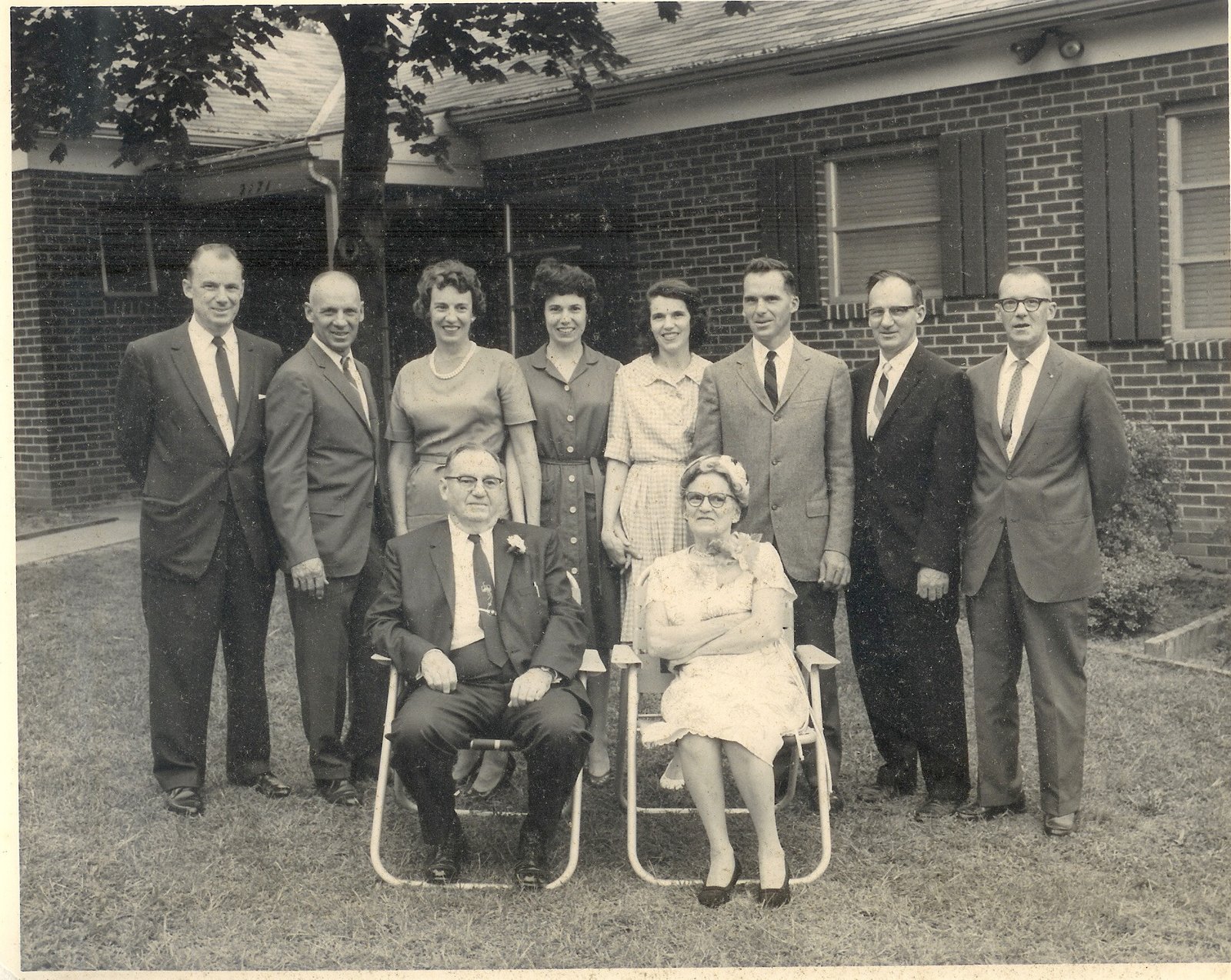 A family portrait of Francis Rowan Kelble, Sr. and Margaret Mary “Maggie” Amrhein Kelble, seated, with an extended family group.