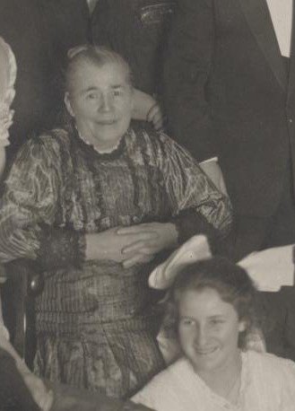 A candid group photograph including Mary D Hughes.