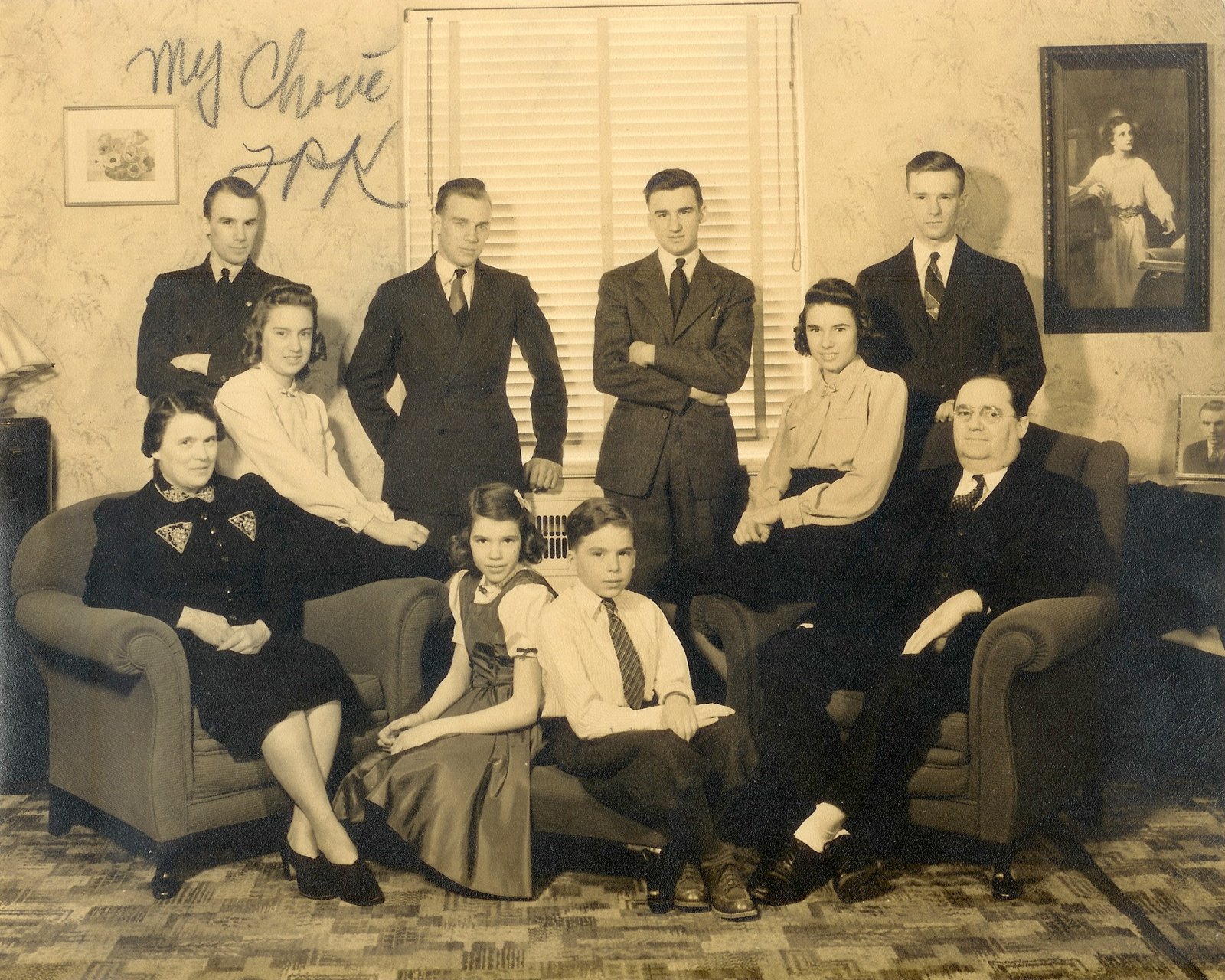 A family portrait of Francis Rowan Kelble, Sr. and Margaret Mary “Maggie” Amrhein Kelble, seated, with their children, including James Richard “Dick” Kelble.